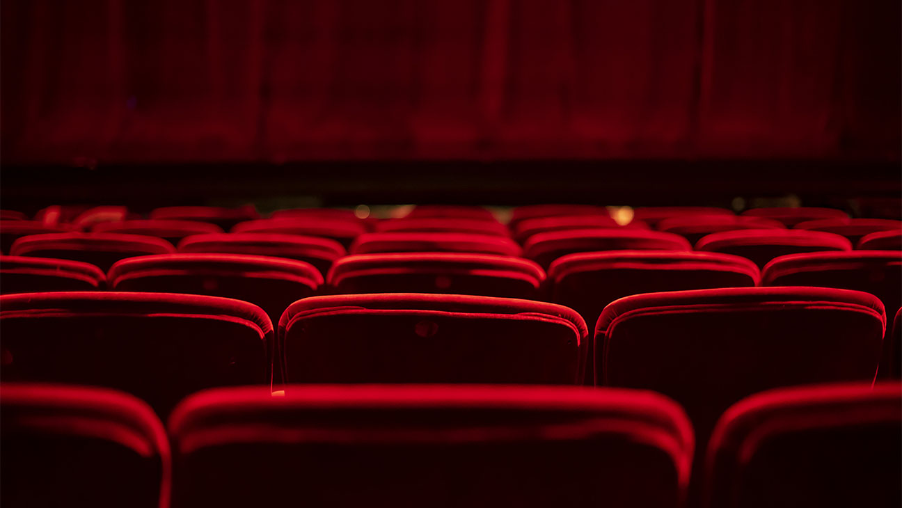 Red seats and curtains of an empty theater