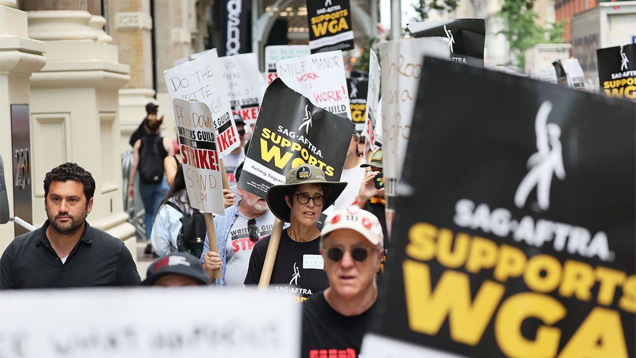 Writers Guild of America East members are joined by SAG-AFTRA members as they picket at the Warner Bros. Discovery NYC office on July 13, 2023 in New York City.
