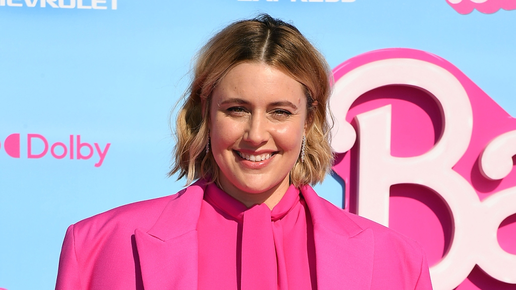 Greta Gerwig on the battle between 'Barbie' and 'Oppenheimer' and Margot Robbie's already iconic foot: 'I've always thought of the arched foot as a bat signal'