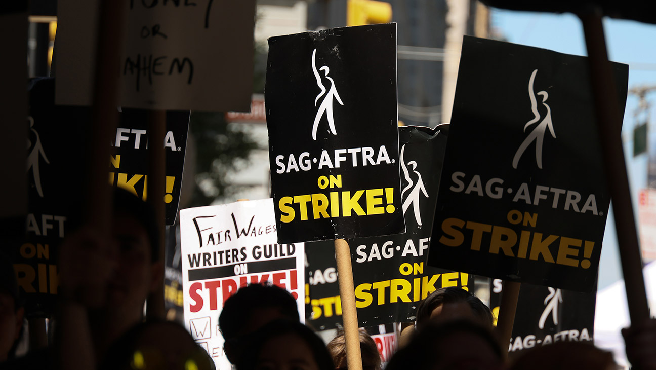 SAG-AFTRA members walk the picket line outside of Netflix and Warner Bros on July 21, 2023 in New York City.