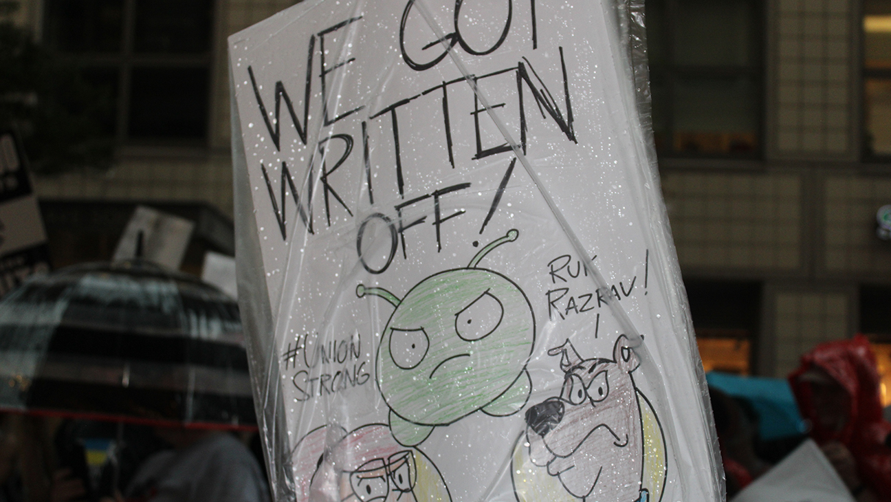WGA East picket sign featuring 'Final Space,' 'Scooby-Doo' and other animated characters